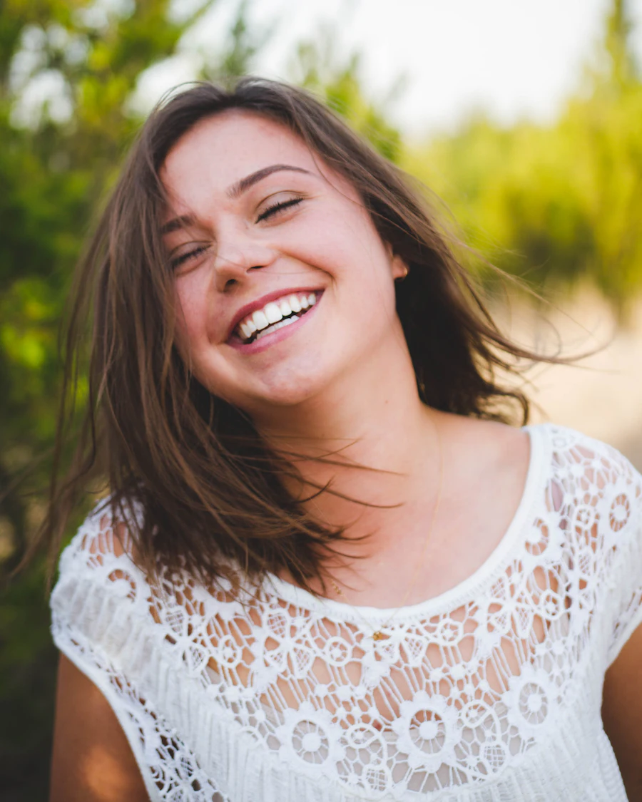 Patient laughing after composite veneer treatment